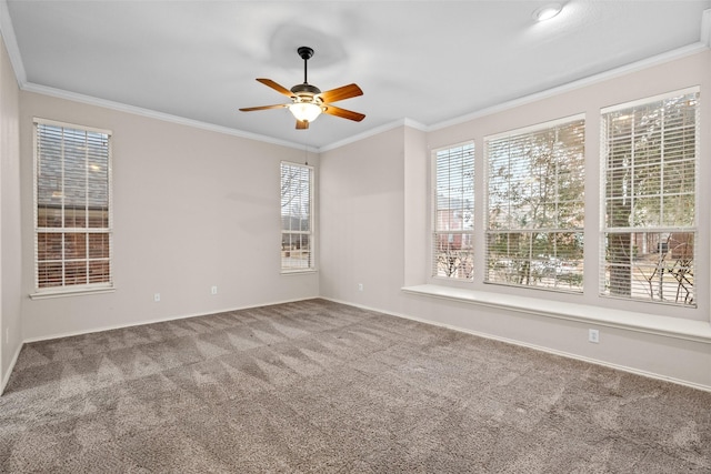 unfurnished room with carpet floors, ornamental molding, and a ceiling fan