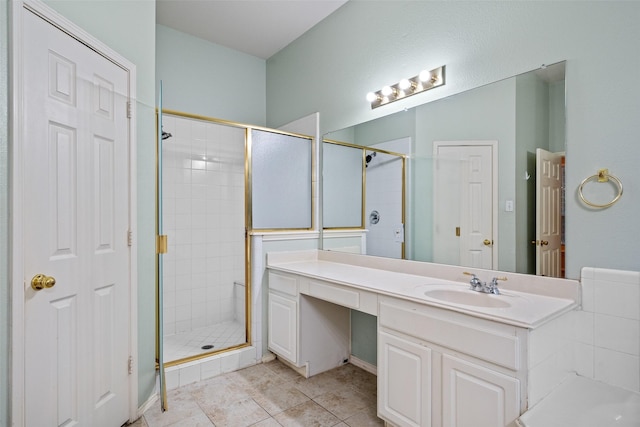 bathroom featuring a stall shower, tile patterned flooring, and vanity