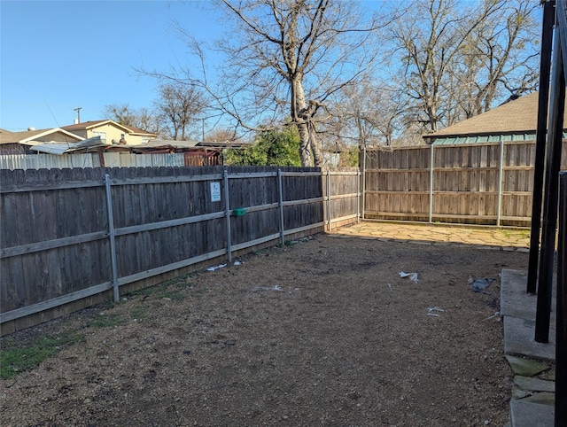 view of yard with a fenced backyard