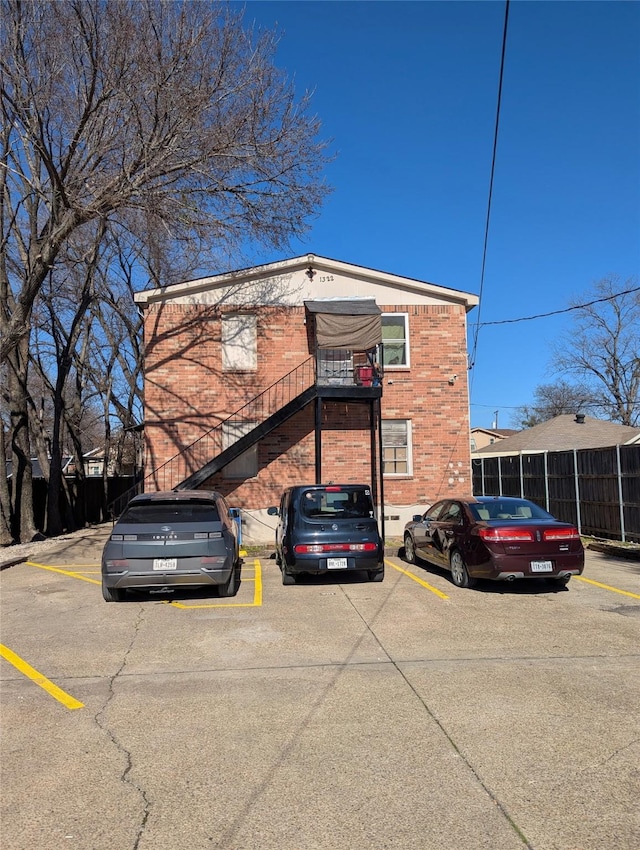 view of property featuring uncovered parking