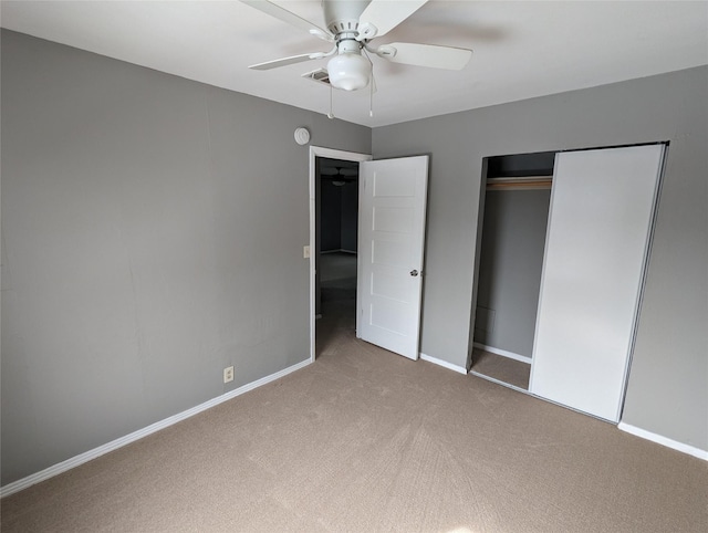 unfurnished bedroom featuring a ceiling fan, a closet, baseboards, and carpet flooring