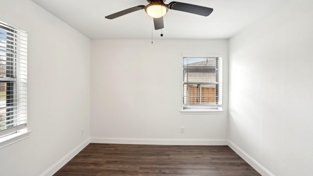 spare room with ceiling fan, wood finished floors, and baseboards