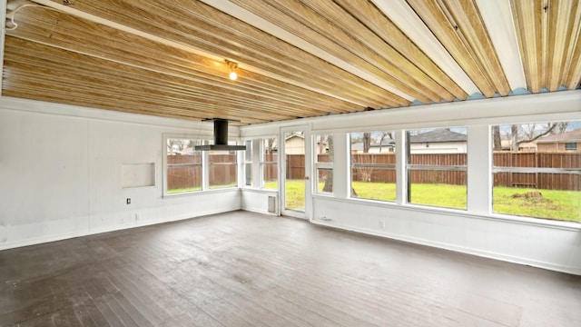 unfurnished sunroom with wood ceiling