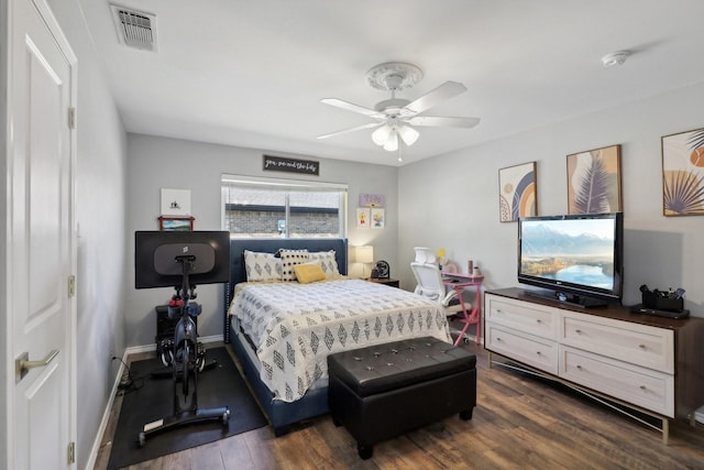 bedroom featuring ceiling fan, baseboards, visible vents, and dark wood finished floors