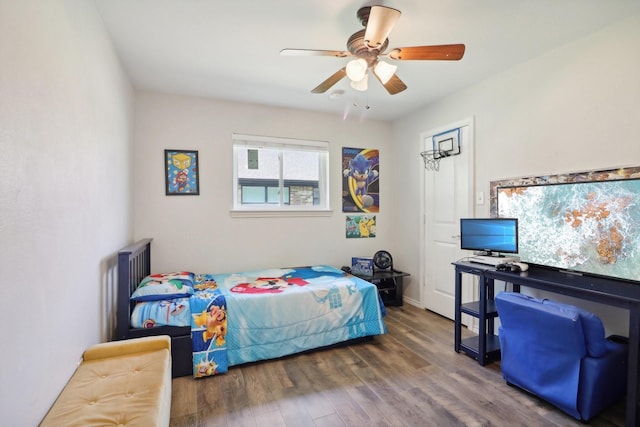 bedroom featuring a ceiling fan and wood finished floors