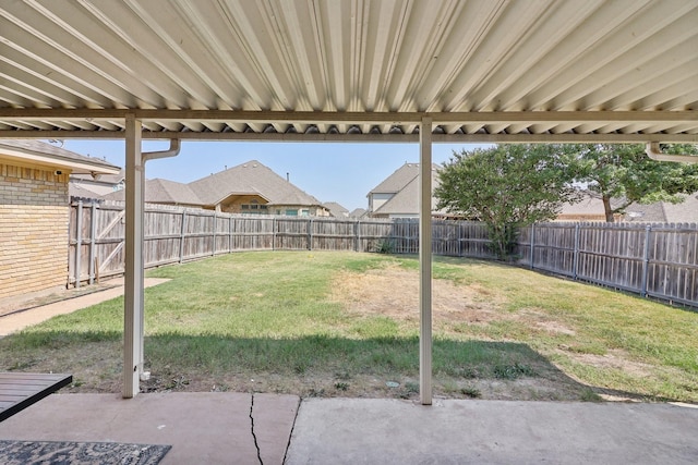 view of yard with a fenced backyard