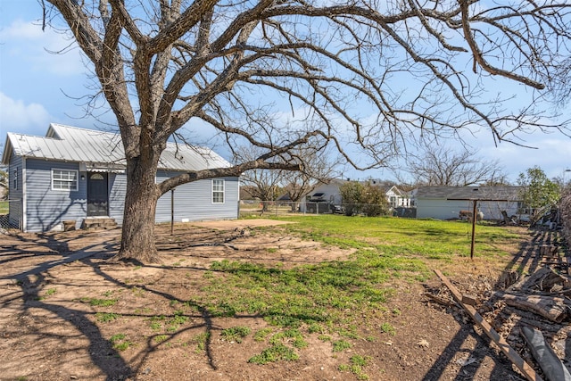 view of yard with entry steps and fence