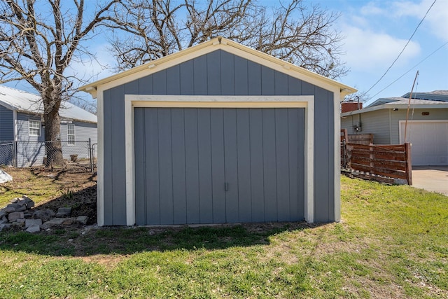 view of shed featuring fence