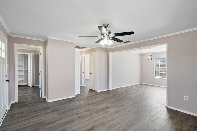 unfurnished living room with ornamental molding, dark wood-style floors, visible vents, and baseboards