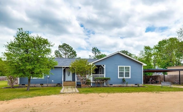 rear view of house with a carport, crawl space, covered porch, and dirt driveway