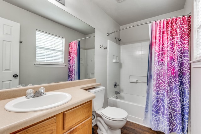 full bathroom featuring wood finished floors, vanity, toilet, and shower / tub combo with curtain