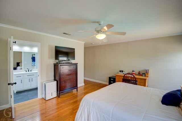 bedroom with visible vents, light wood-style flooring, ornamental molding, ceiling fan, and baseboards