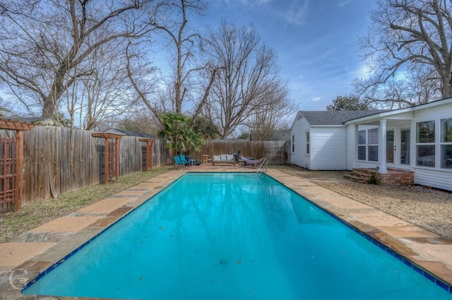 view of pool featuring a patio, french doors, a fenced backyard, and a fenced in pool