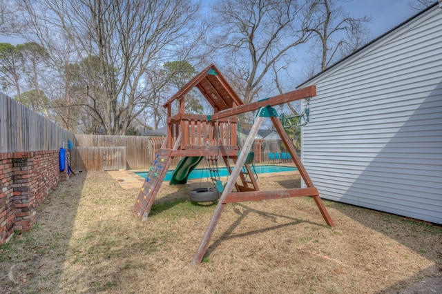 view of playground with a fenced backyard