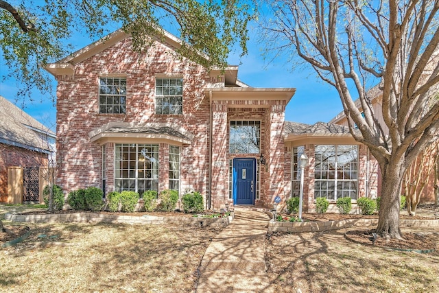 view of front of home with brick siding