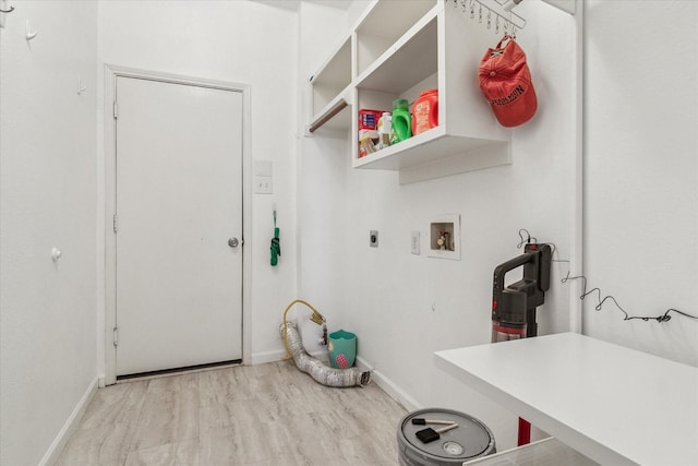 laundry area featuring hookup for a washing machine, wood finished floors, baseboards, hookup for an electric dryer, and laundry area