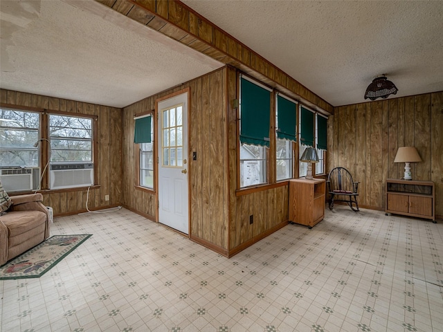 unfurnished sunroom with cooling unit