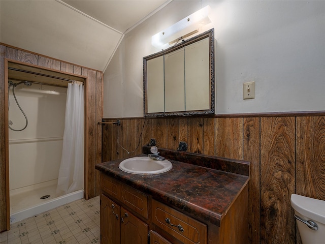 full bathroom featuring lofted ceiling, wainscoting, and wooden walls