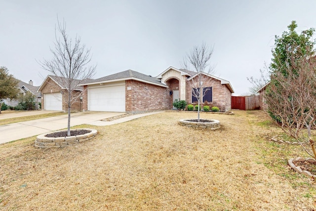 ranch-style house with a garage, brick siding, fence, concrete driveway, and a front lawn