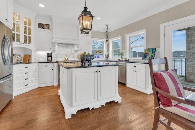 kitchen with dark countertops, white cabinets, and stainless steel appliances