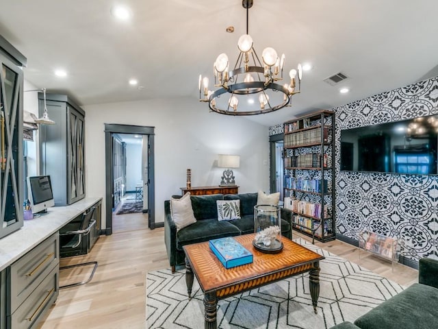 living room featuring lofted ceiling, recessed lighting, visible vents, light wood-style floors, and baseboards