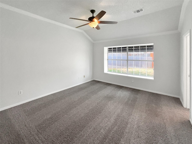 unfurnished room with ornamental molding, carpet, visible vents, and vaulted ceiling