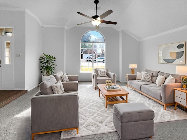 living room with baseboards, visible vents, lofted ceiling, ceiling fan, and crown molding