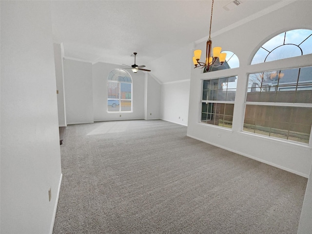 carpeted empty room featuring crown molding, lofted ceiling, visible vents, baseboards, and ceiling fan with notable chandelier