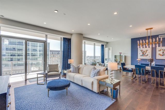 living area featuring visible vents, wood finished floors, and recessed lighting