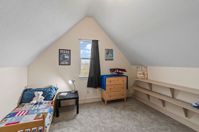 interior space featuring carpet, vaulted ceiling, and a textured ceiling