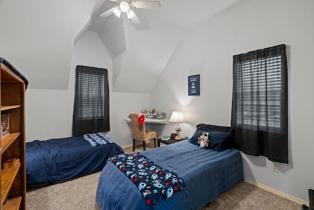 carpeted bedroom with lofted ceiling, ceiling fan, and baseboards