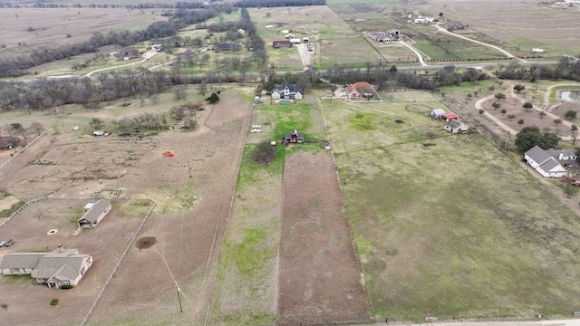 birds eye view of property featuring a rural view