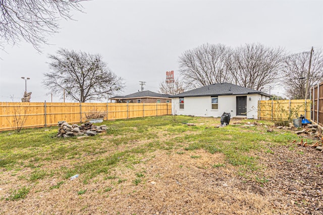 view of yard with a fenced backyard