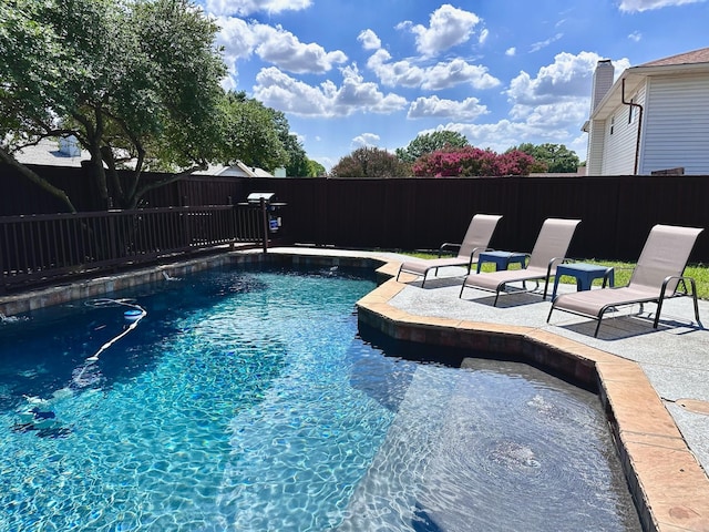 view of pool featuring a fenced in pool, a patio area, and a fenced backyard