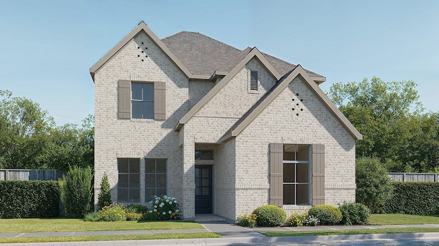 french country style house with brick siding, a front yard, fence, and a shingled roof