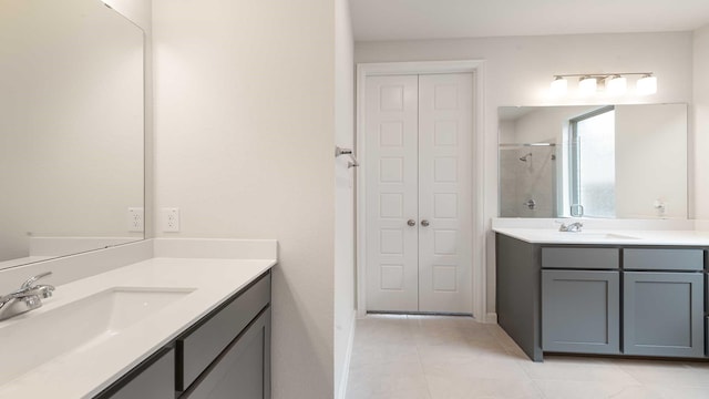 4343 Hudson St, Fate, TX 75087 - full bath with a shower stall, two vanities, and tile patterned floors