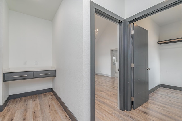 interior space featuring light wood-style floors and baseboards