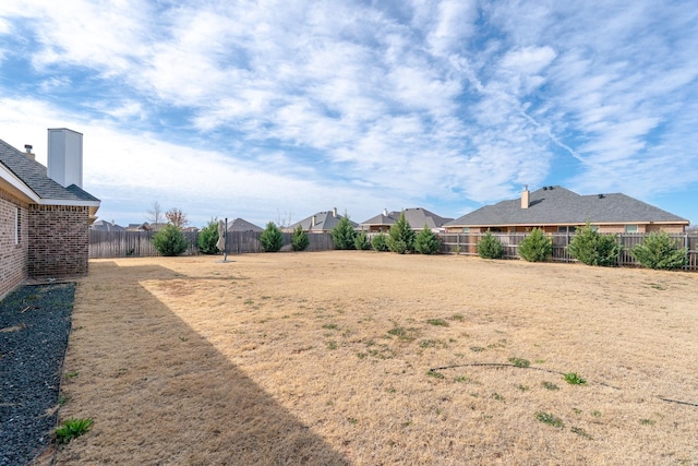 view of yard featuring a fenced backyard