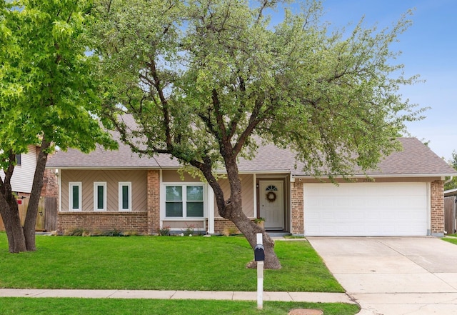 ranch-style house with brick siding, a shingled roof, a front lawn, concrete driveway, and an attached garage