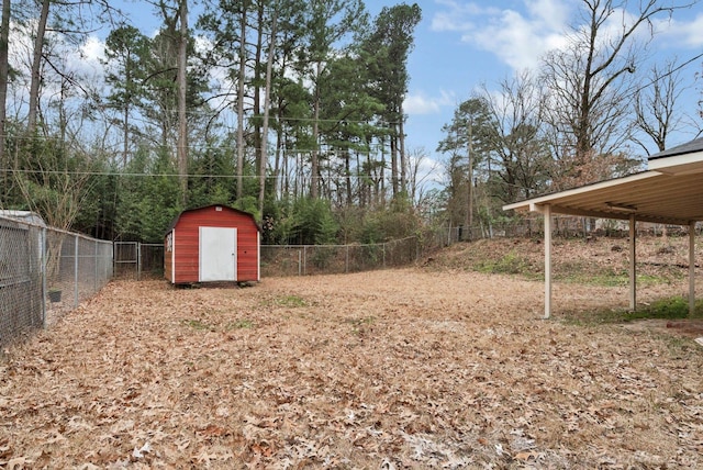 view of yard featuring a fenced backyard, an outdoor structure, and a shed