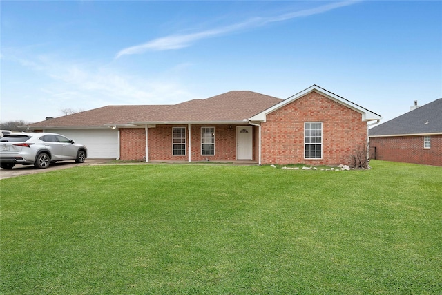 ranch-style house featuring a garage, brick siding, a shingled roof, and a front yard