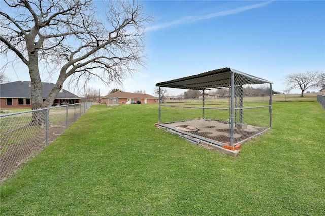 view of yard with an outbuilding and fence