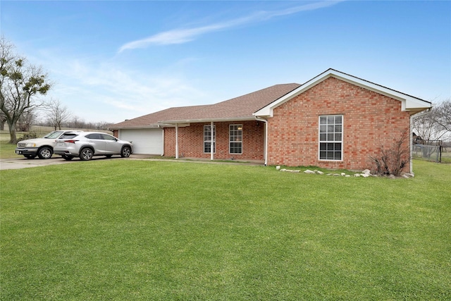 single story home featuring brick siding, a front yard, fence, a garage, and driveway