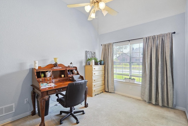 office area featuring vaulted ceiling, light carpet, visible vents, and baseboards