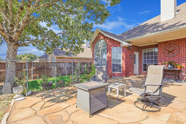 view of patio featuring fence