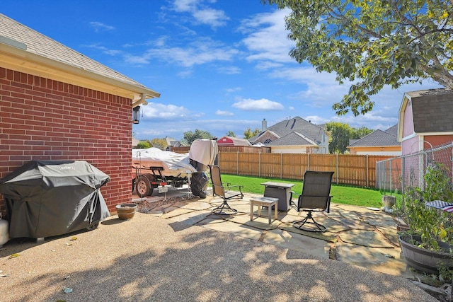 view of patio featuring grilling area and a fenced backyard