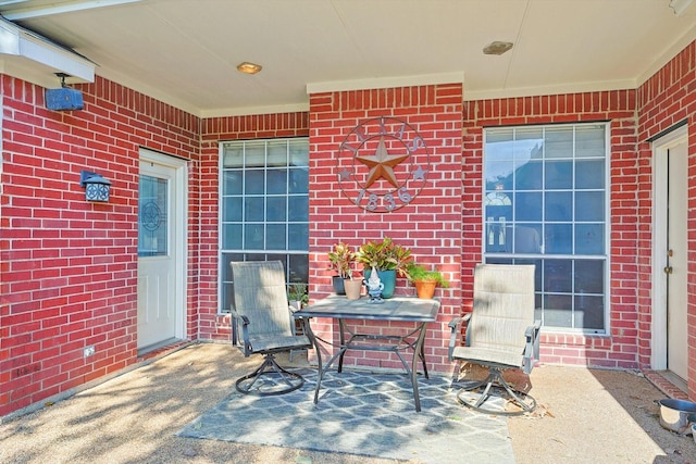 entrance to property with brick siding