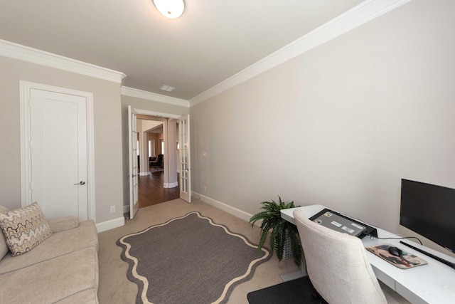 office area featuring light colored carpet, crown molding, and baseboards