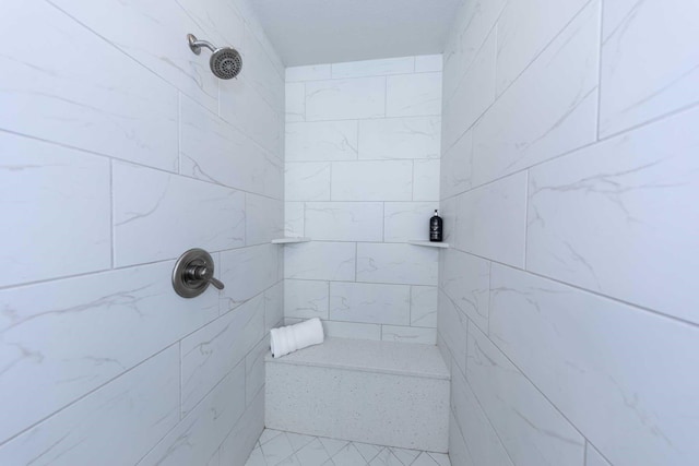 full bathroom with a tile shower