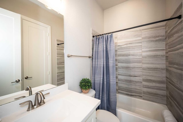 bathroom with vanity, toilet, and shower / tub combo